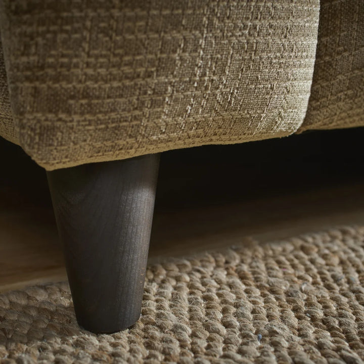 Sofa legs and lower frame with textured olive-brown upholstery