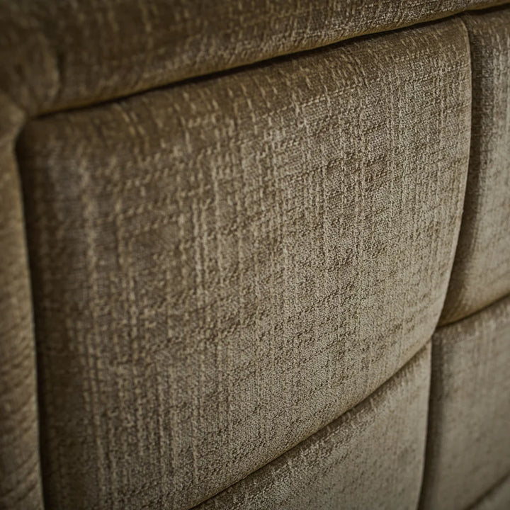 Sofa upholstery close-up in textured olive-brown fabric