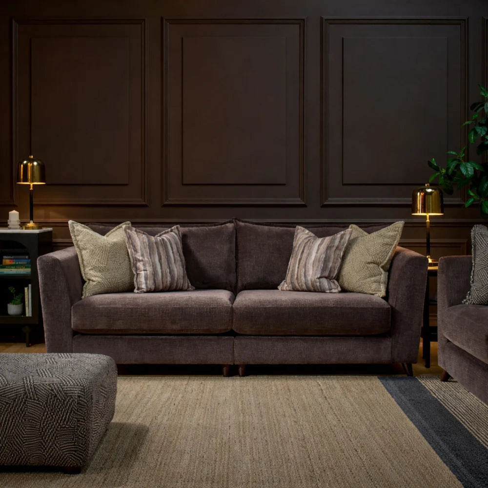 4-seater modular sofa with dark gray upholstery and patterned throw pillows