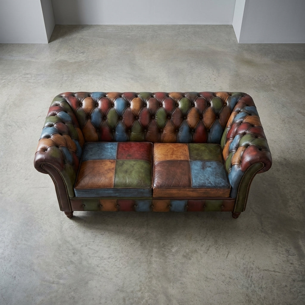 Top-down view of the Chester Croft sofa displaying patchwork leather with subtle color variations in a minimalist environment.