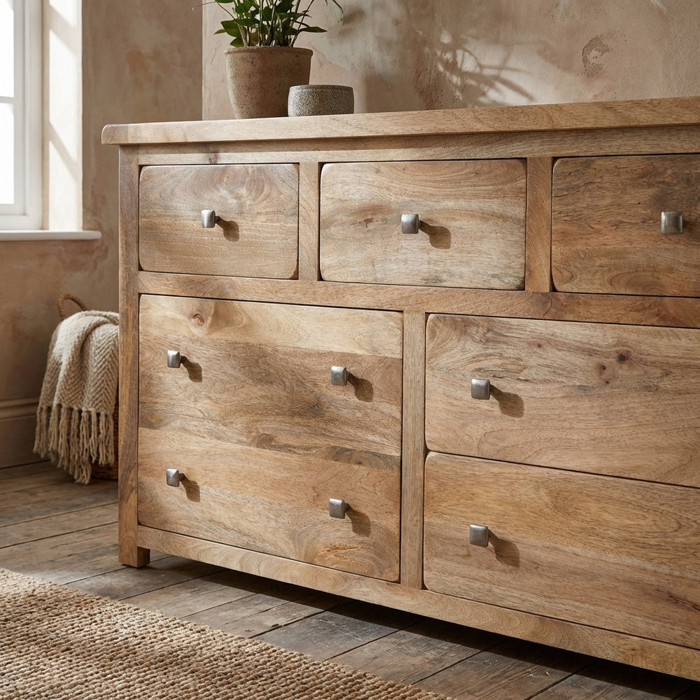 Close-up of Odisha Mango Wood 7 Drawer Chest highlighting textured mango wood surface and iron cushion knobs.